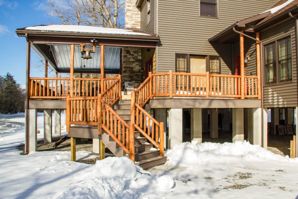 snowcovered log stair railing